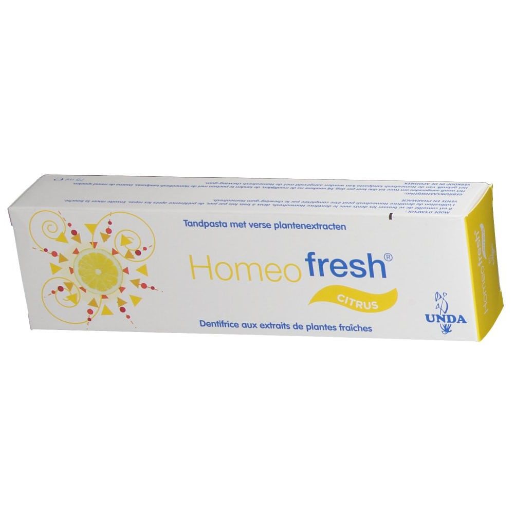 Boîte de dentifrice. Inscription Homeofresh Citrus. Logo jaune. Marque UNDA. Texte multilingue.