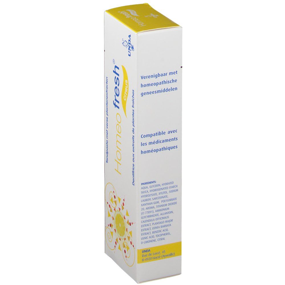 Boîte de dentifrice. Inscription Homeofresh Citrus. Logo jaune. Marque UNDA. Texte multilingue.