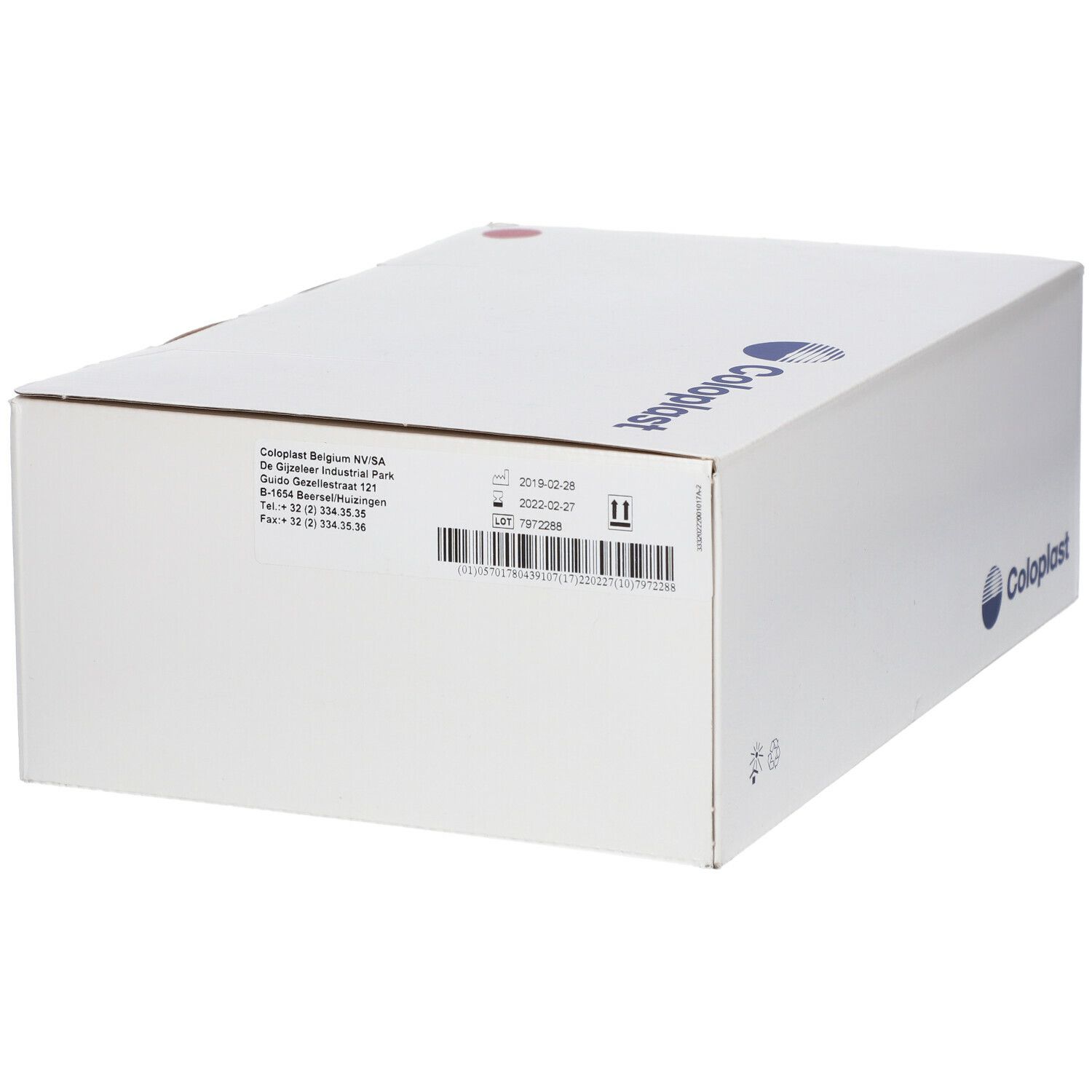 Boîte blanche Coloplast avec informations d'adresse. Logo et texte Coloplast. Point rouge.