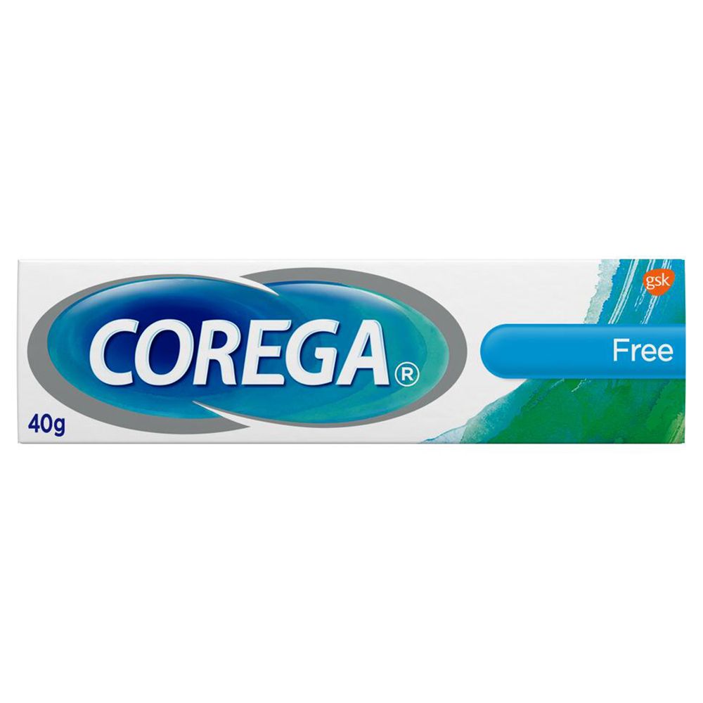 Tube de crème adhésive pour prothèses dentaires COREGA® Free. Tube blanc avec bande bleue et texte. 40g.