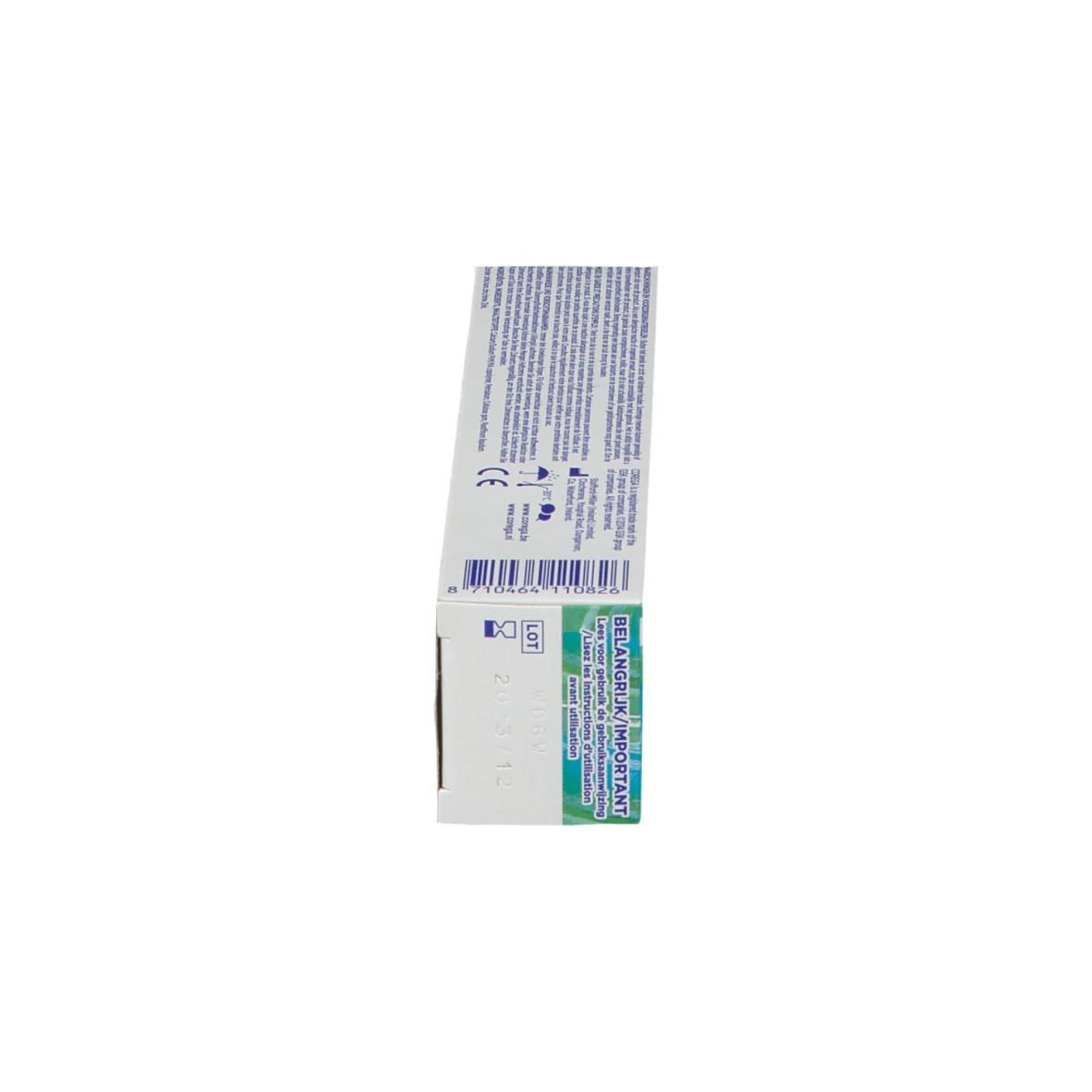 Côté de la boîte de crème adhésive pour prothèses dentaires COREGA® Free. Boîte blanche avec texte et code-barres.