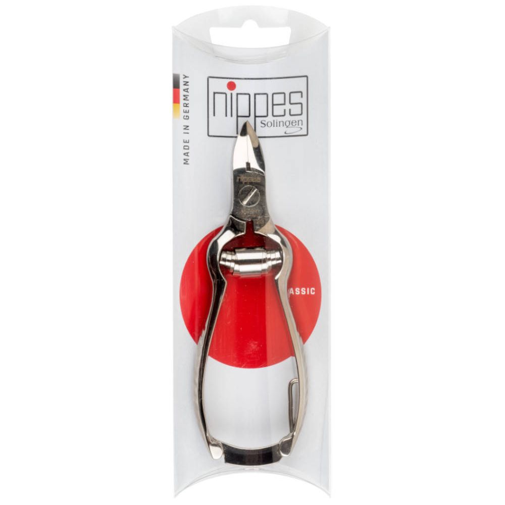 Pince à ongles en blister. Marque Nippes, Solingen. Outil métallique sur fond rouge. Fabriqué en Allemagne.