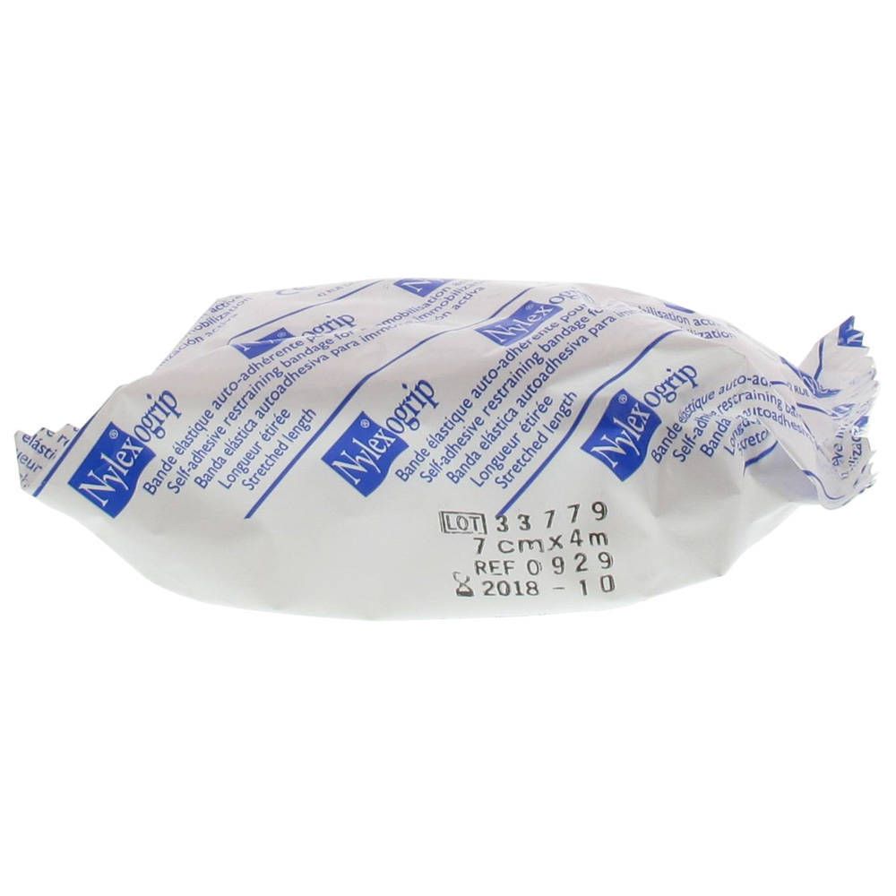 Bandage emballé. Inscription Nylexogrip, 7cm x 4m. Texte en plusieurs langues.