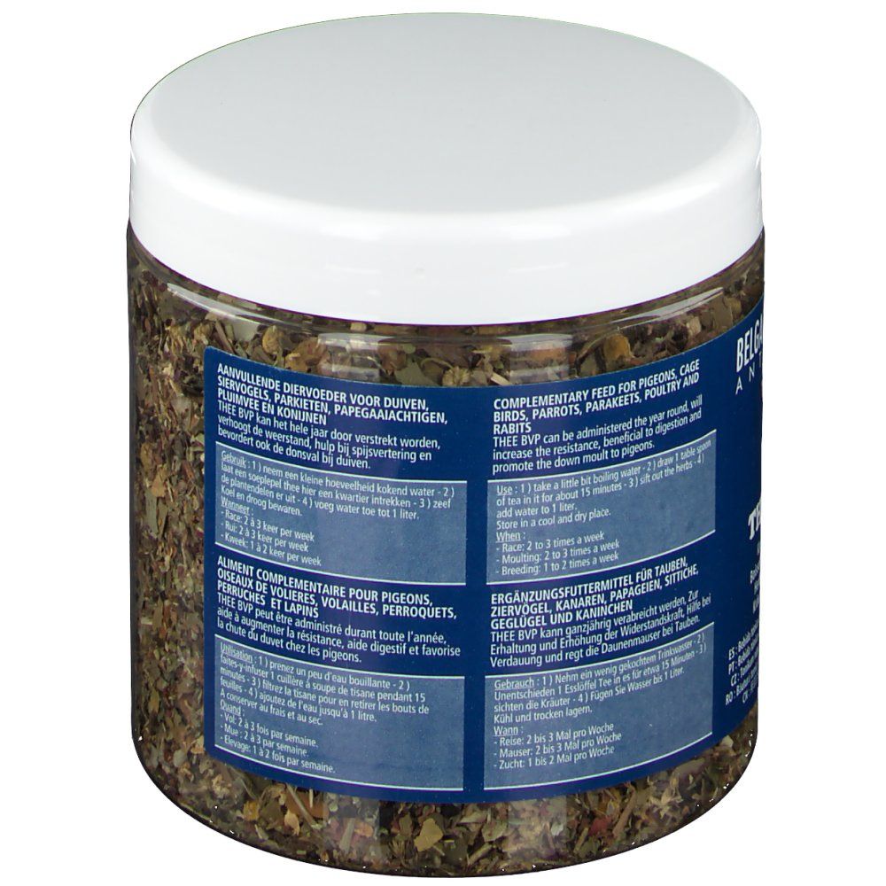 Pot d'herbes, vue oblique arrière. Couvercle blanc. Étiquette bleue avec instructions pour oiseaux. Texte: Aliment complémentaire.