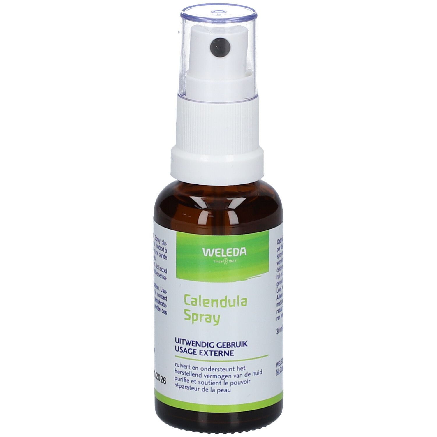 Bruine glazen fles met witte spraykop. Opschrift: Weleda, Calendula Spray. Etiket met tekst in meerdere talen.