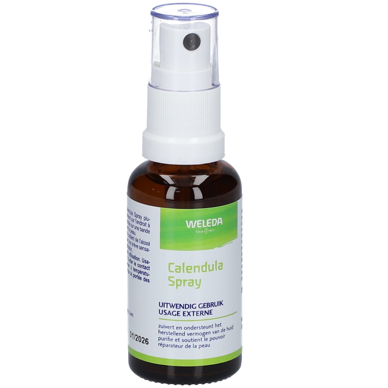 Bruine glazen fles met witte spraykop. Opschrift: Weleda, Calendula Spray. Etiket met tekst in meerdere talen.