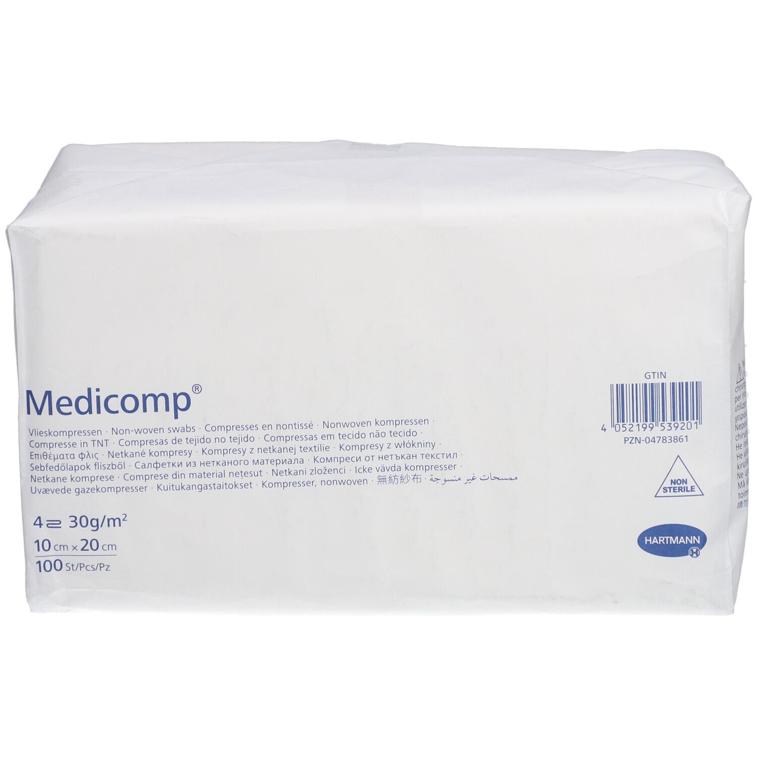 Paquet blanc rectangulaire avec "Medicomp". Contient des compresses. Dimensions: 10x20cm. 4 couches. Fabricant: HARTMANN. Code-barres.