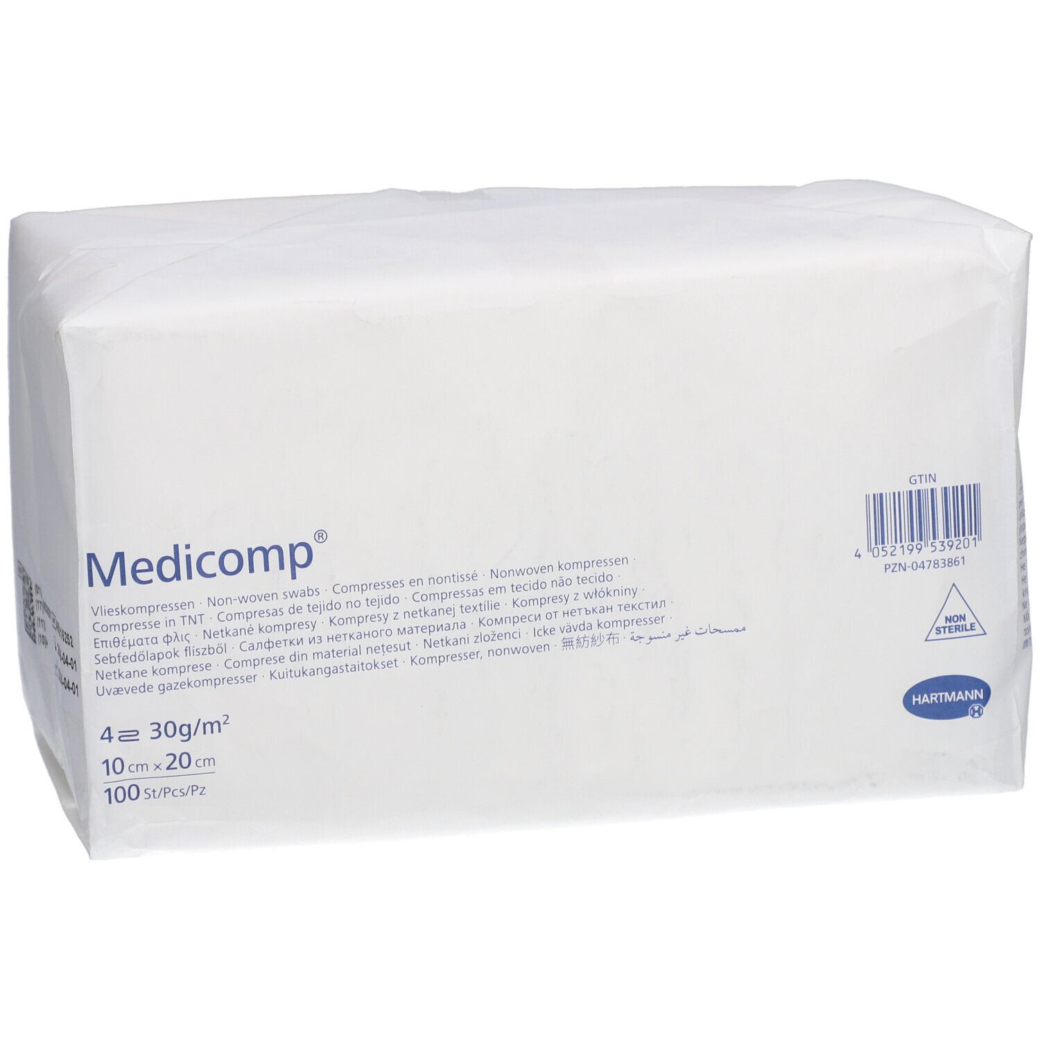 Paquet blanc rectangulaire avec "Medicomp". Contient des compresses. Dimensions: 10x20cm. 4 couches. Code-barres.
