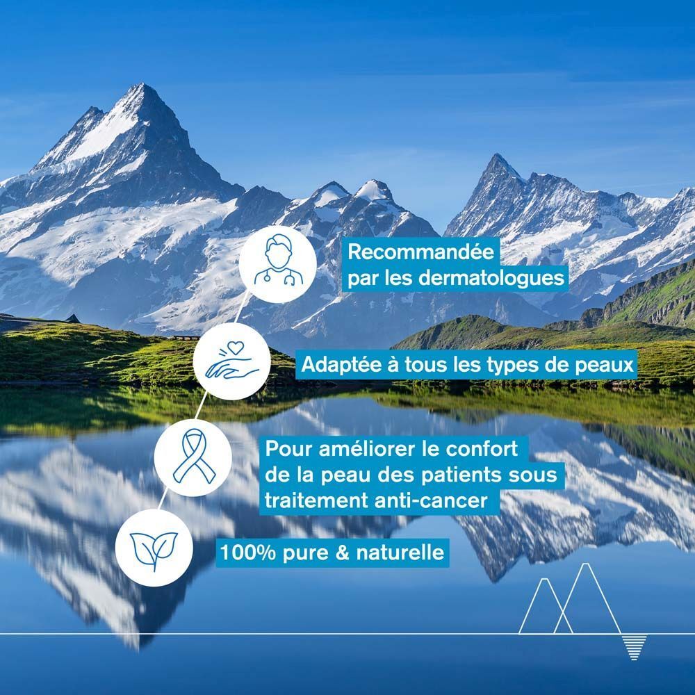 Paysage avec montagnes et lac. Texte : Recommandée par les dermatologues. Adaptée à tous les types de peaux.