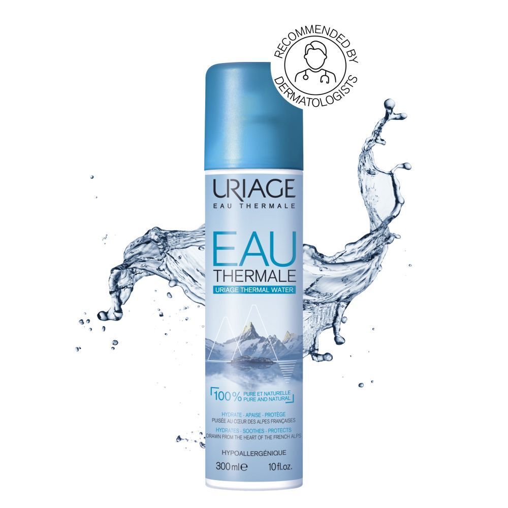 Uriage Eau Thermale spray. Blauwe spuitfles met blauwe dop. Waterspetters.