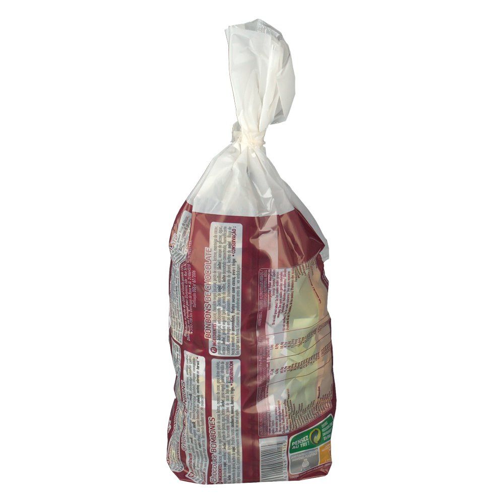 Dos d'un sachet de bonbons au chocolat. Texte en plusieurs langues. Fond rouge, emballage transparent, fermeture blanche.