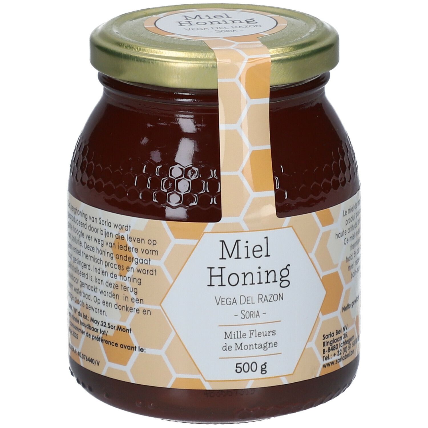 Glazen pot honing met gouden deksel. Etiket met productnaam, merk en gewicht. Honing donkerbruin.