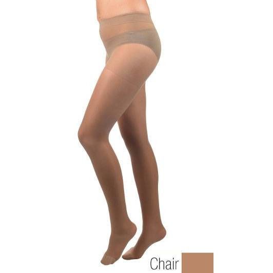 Collant de soutien couleur chair. Vue latérale d'une personne portant le collant. Pieds et jambes visibles.