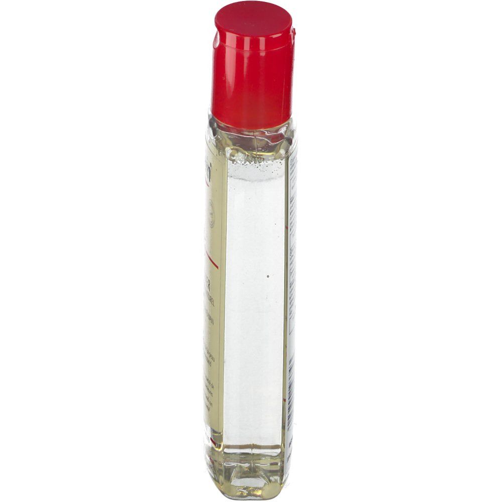 Flacon transparent étroit avec bouchon rouge, vue latérale. Produit pour peaux sèches et sensibles.