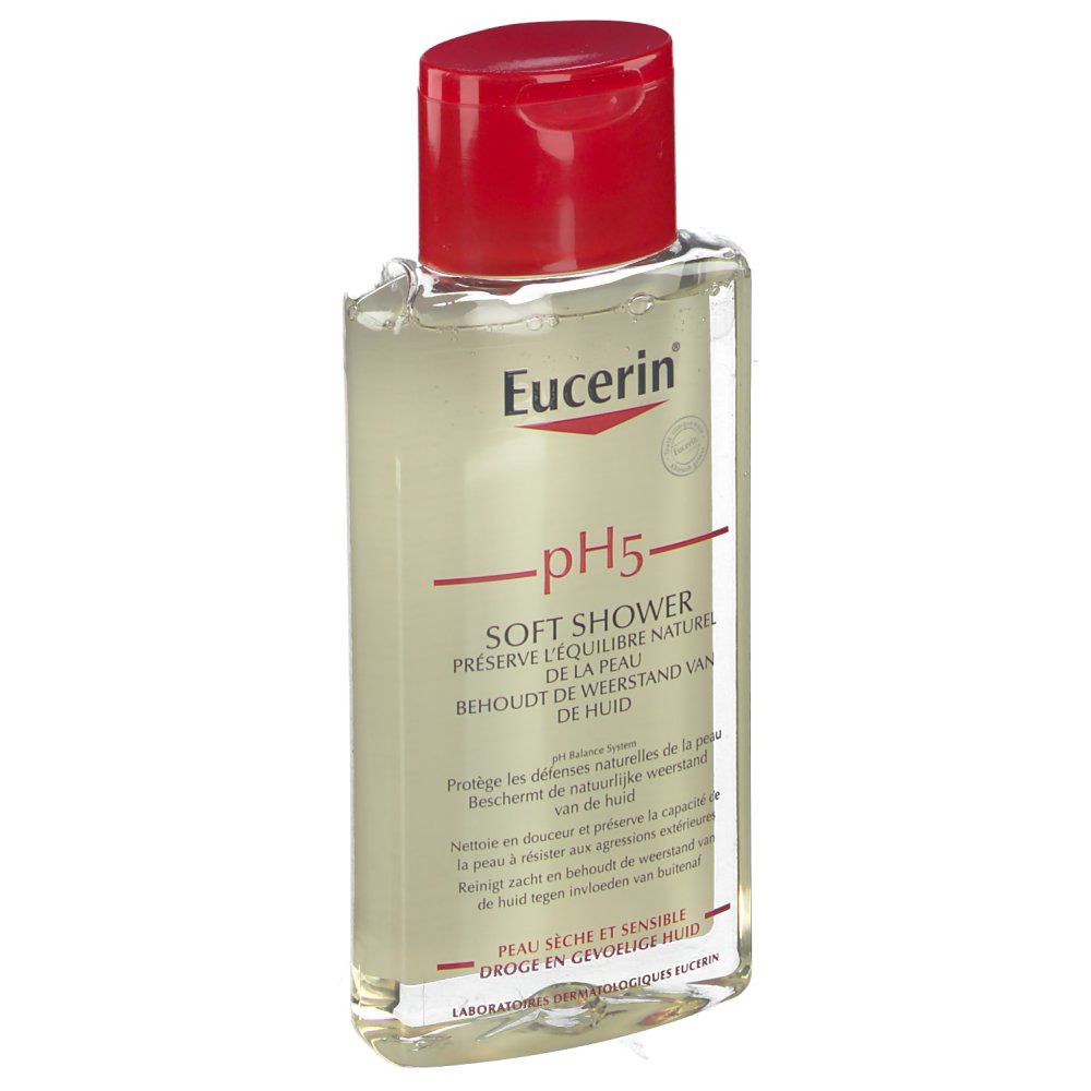 Flacon transparent avec bouchon rouge. Inscription: Eucerin pH5 Soft Shower. Produit pour peaux sèches et sensibles.
