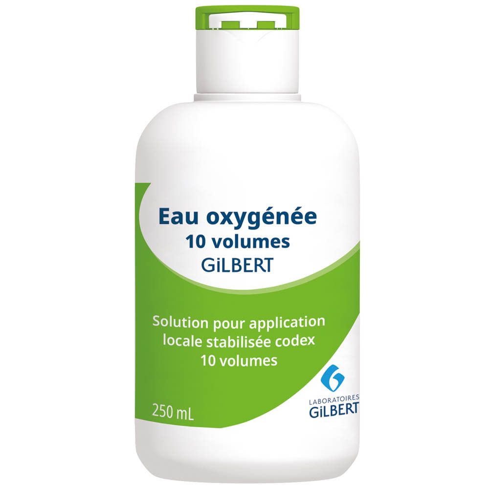 Witte fles met groen etiket. Tekst: Eau oxygénée 10 volumes GILBERT. 250 ml. Voor lokale toepassing.