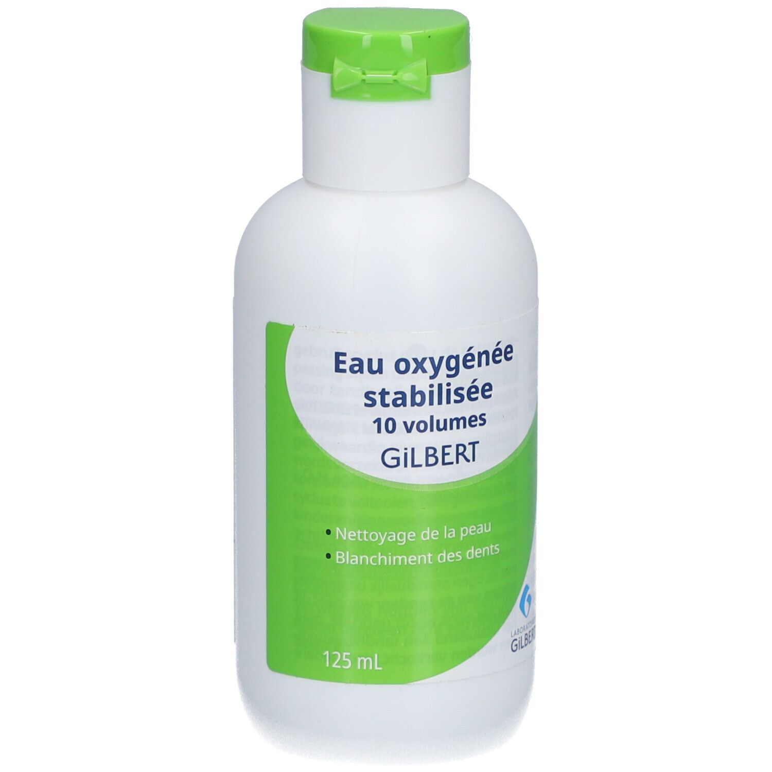 Witte fles met groen etiket. Tekst: Eau oxygénée stabilisée 10 volumes GILBERT. Voor huid en tanden. 125 ml.