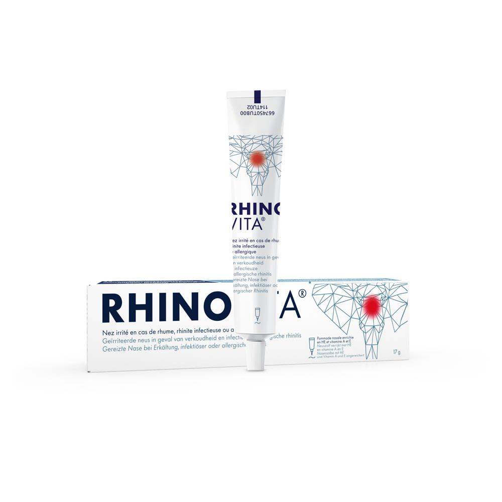 Tube et boîte RHINOVITA. Texte multilingue. 17g. Illustration d'une tête avec point rouge. Emballage du produit.