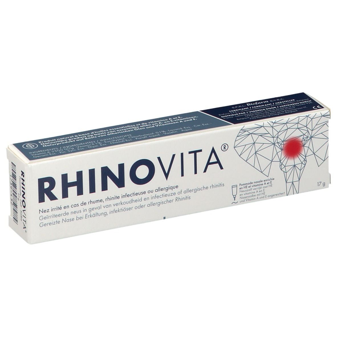 Boîte blanche RHINOVITA. Texte multilingue. 17g. Illustration d'une tête avec point rouge. Marque et informations sur le produit.
