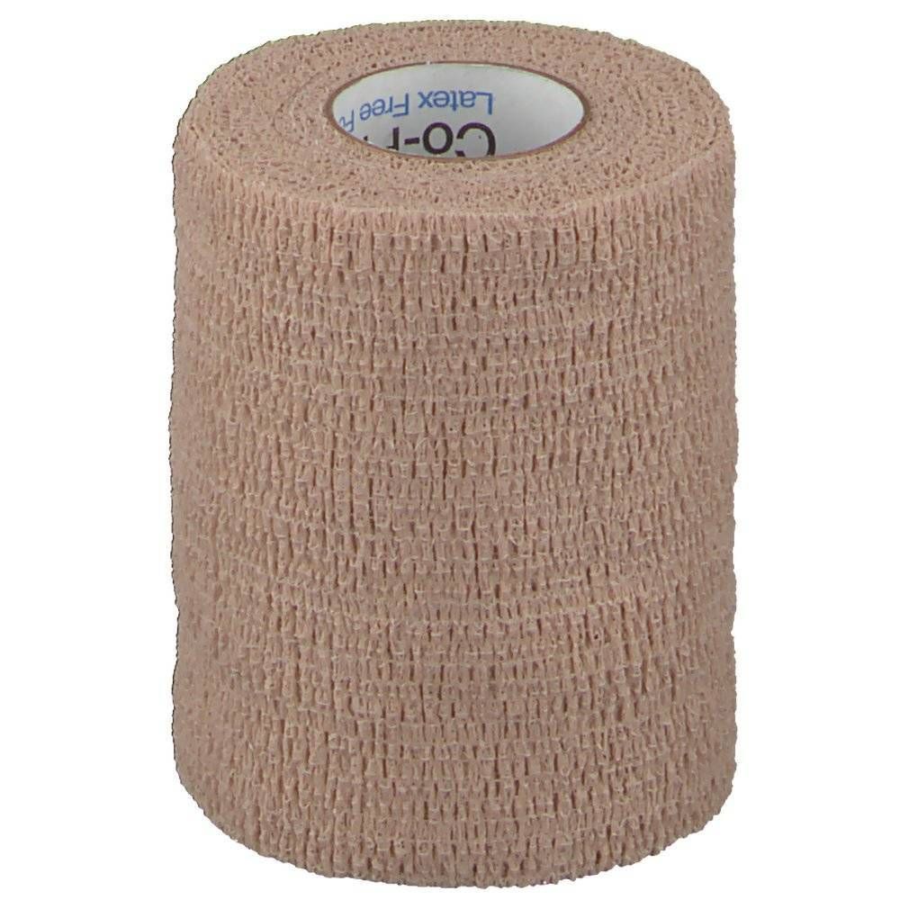Rouleau de bandage cohésif beige. Le nom de la marque Co-Plus est visible à l'intérieur.
