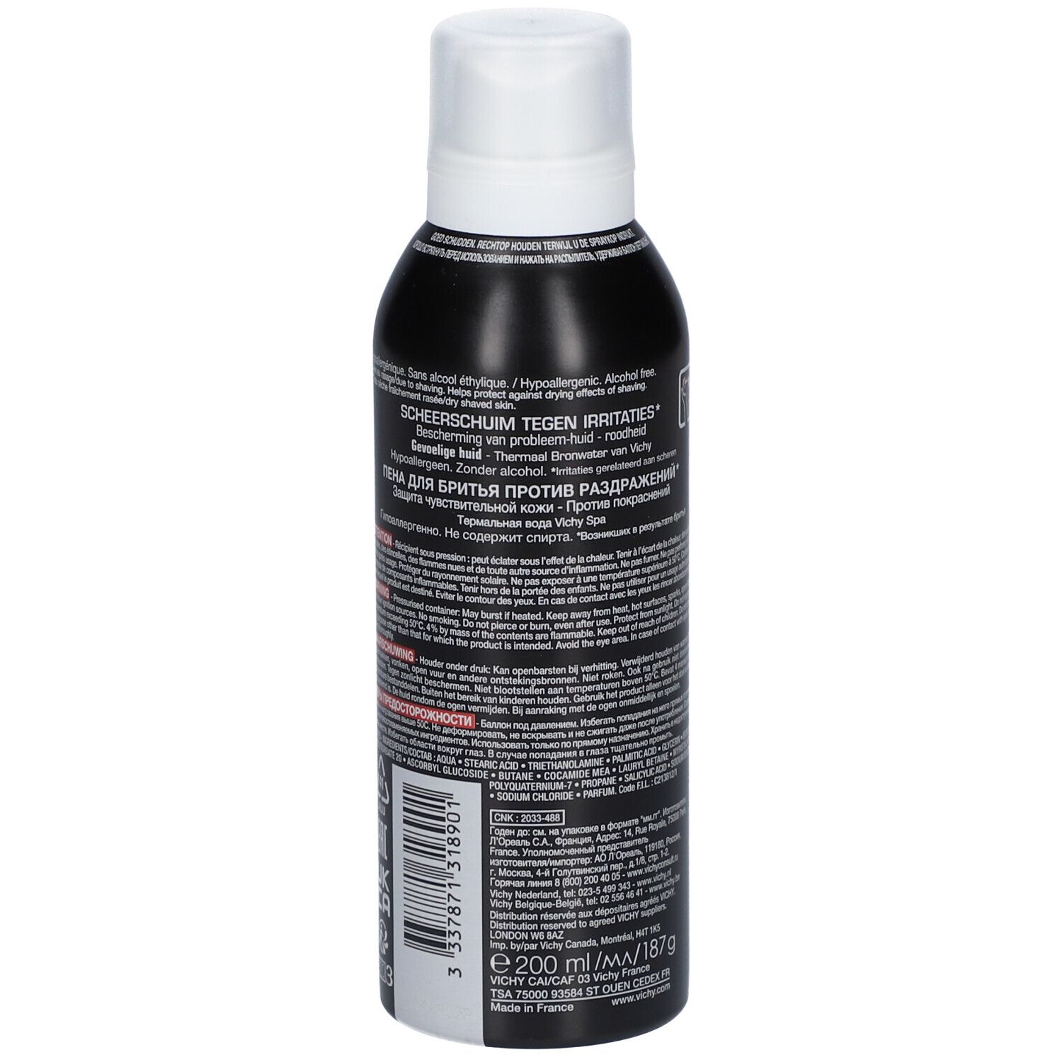 Rückseite der schwarzen Flasche. Text: SCHEERSCHUIM TEGEN IRRITATIES, Inhaltsstoffe, Anwendungshinweise, Warnhinweise, 200 ml/187 g.
