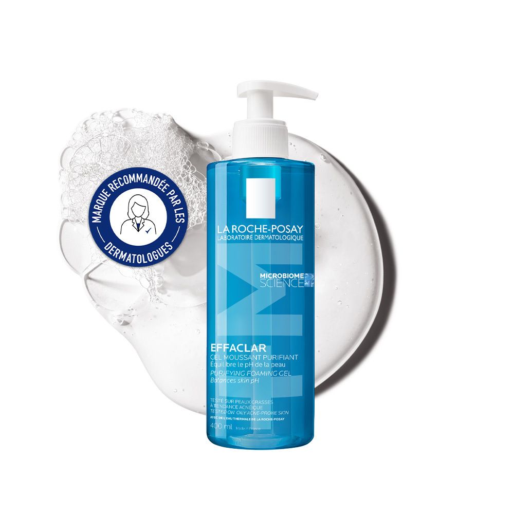 Flacon bleu avec pompe blanche. Mousse et logo.