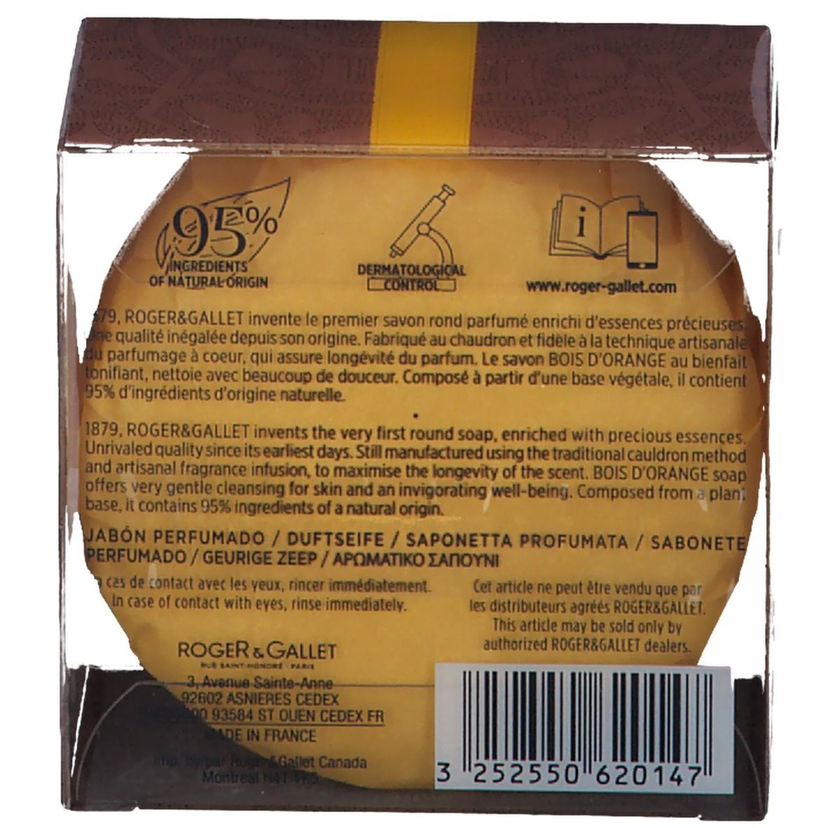 Ronde gele zeep in transparante doos. Achterkant met tekst, logo's, barcode. ROGER & GALLET, Bois d'Orange.