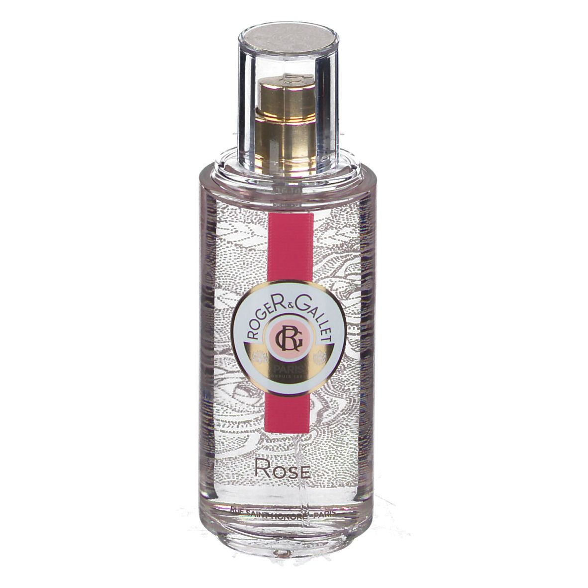 Transparante fles met gouden verstuiver. Label met logo en tekst. Rode streep. Opschrift Rose.