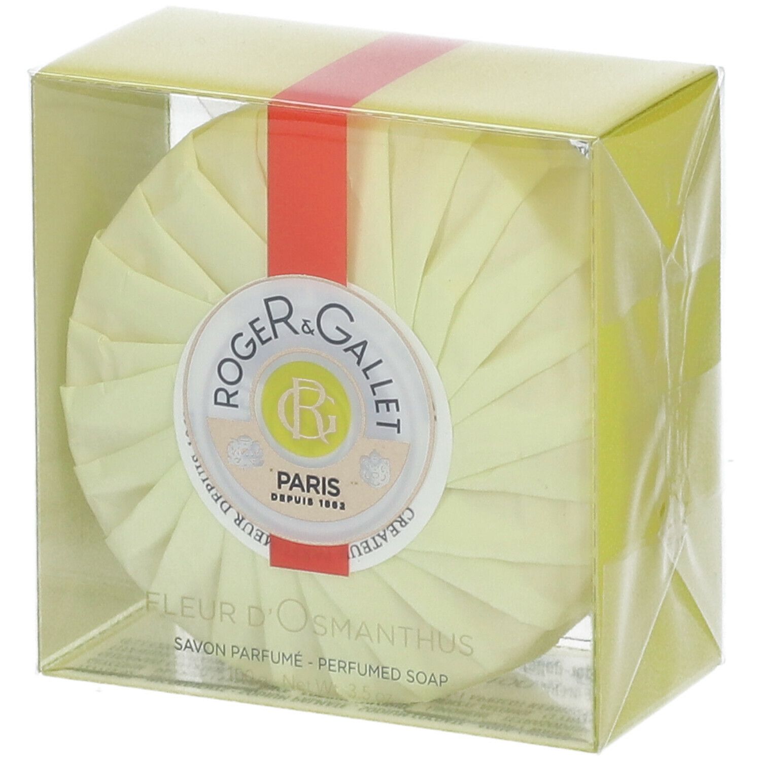 Savon rond emballé en jaune. Ruban rouge. Logo Roger & Gallet. Texte: Fleur d'Osmanthus, Savon Parfume.