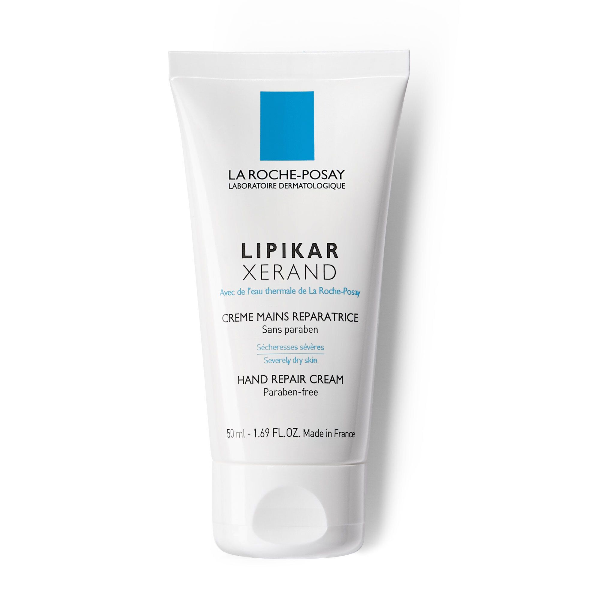 Witte tube La Roche-Posay Lipikar Xerand handcrème. Blauw logo vierkant. Tekst: Paraben-free.