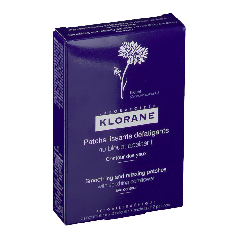 Boîte bleu foncé de patchs pour les yeux. Inscription: KLORANE, Patchs lissants défatigants, au bleuet apaisant. Avec fleur de bleuet.