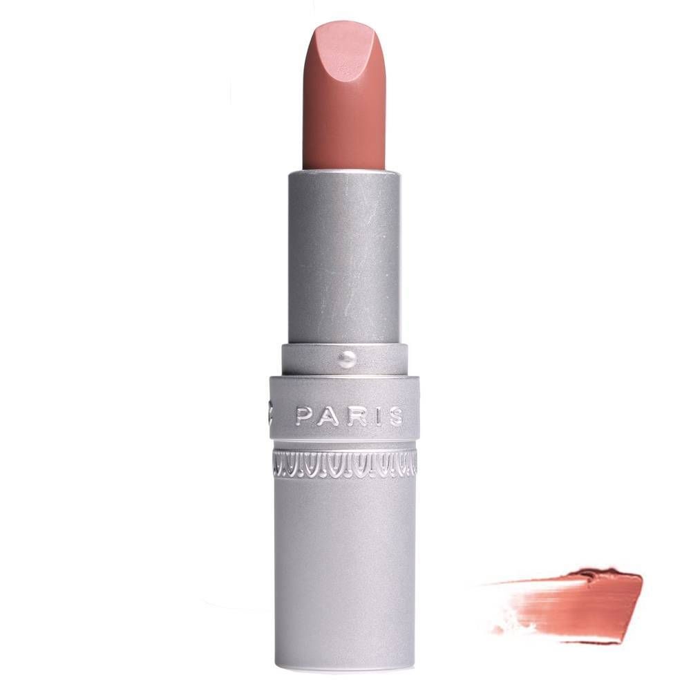 Rouge à lèvres rose clair dans un étui argenté. Inscription "PARIS" sur l'étui. À côté, une trace de couleur.