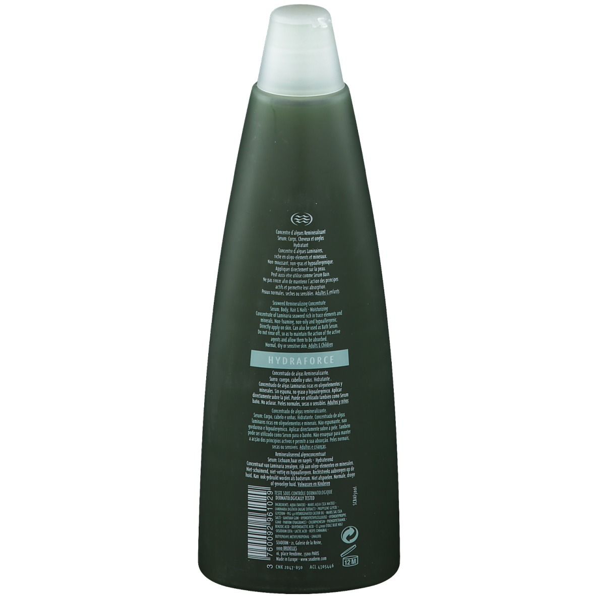 Achterkant van de fles. Tekst in meerdere talen. Informatie over het product en gebruik. Dermatologisch getest.