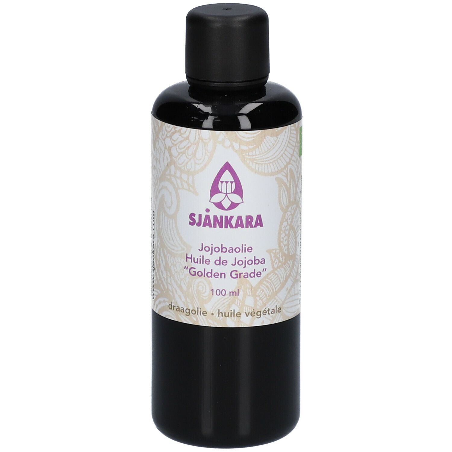 Flacon brun avec bouchon noir. Étiquette avec nom du produit SJANKARA, huile de jojoba et autres informations.