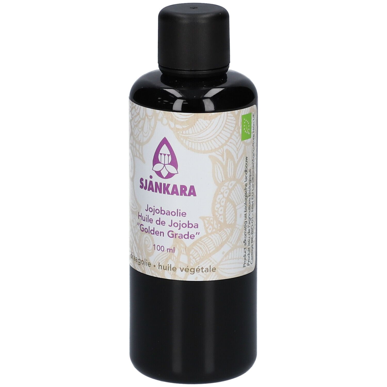 Flacon brun avec bouchon noir. Étiquette avec nom du produit SJANKARA, huile de jojoba et autres informations.