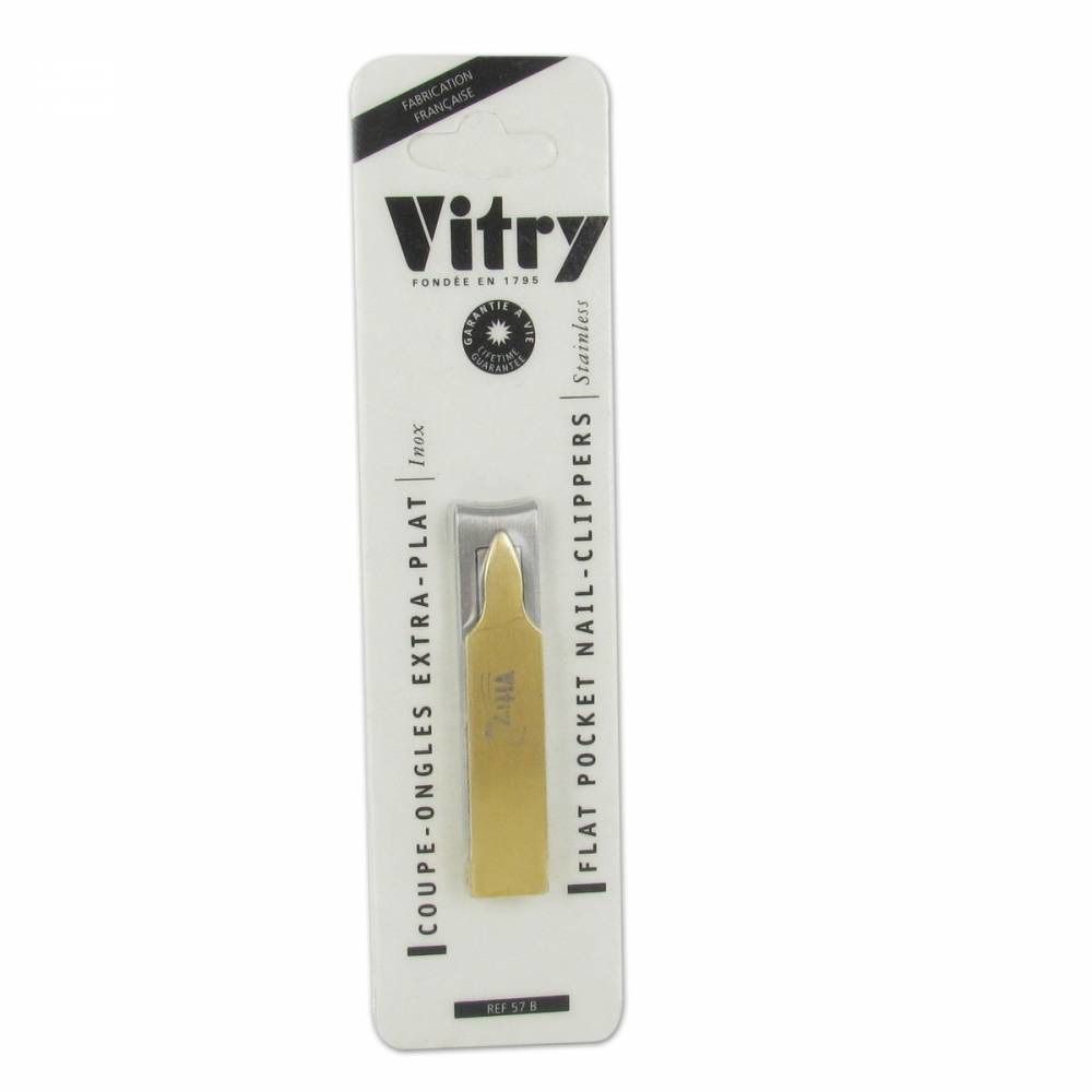 Goudkleurige nagelknipper in verpakking. Merk Vitry. Opschrift: Coupe-ongles extra-plat, Flat pocket nail-clippers, Stainless.
