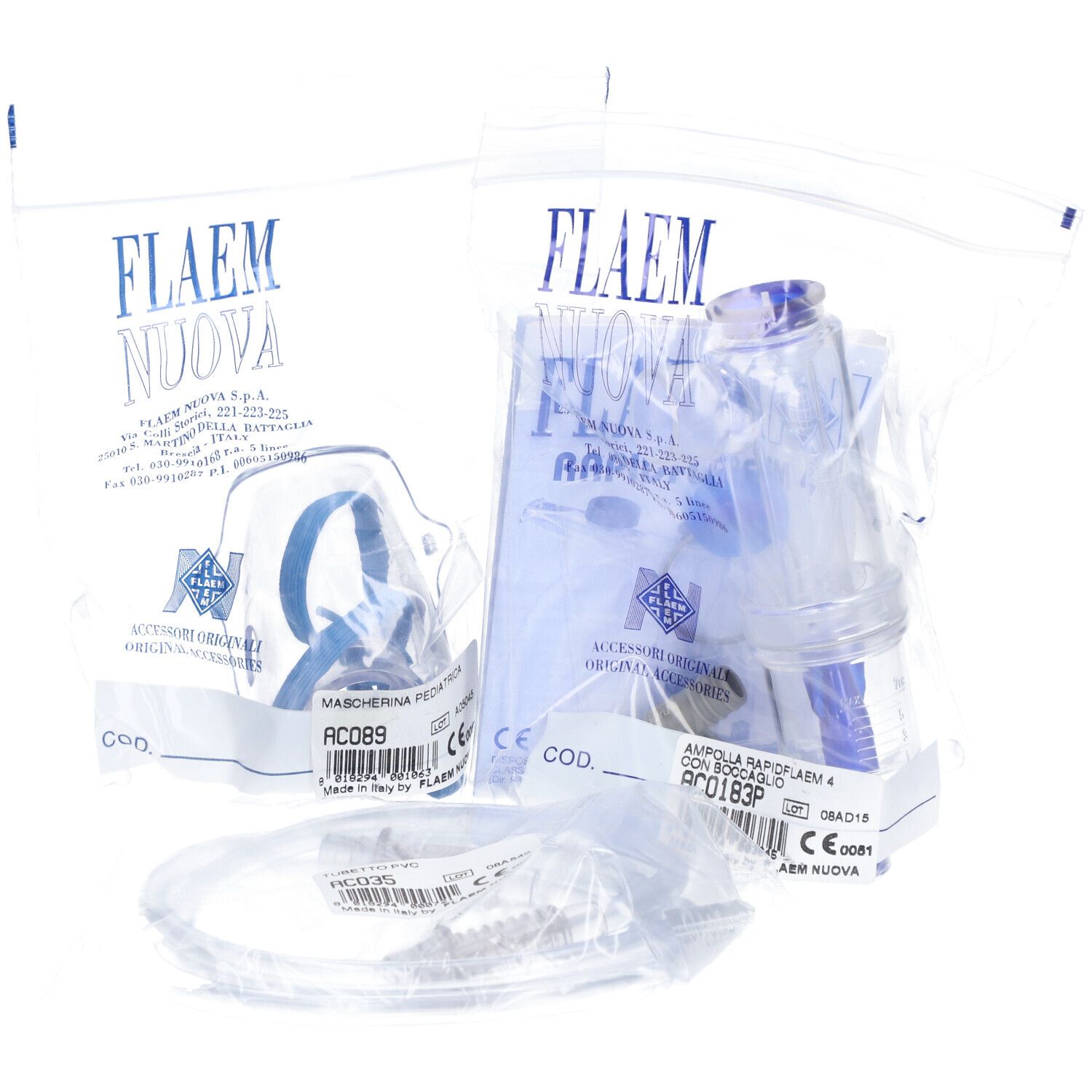 Plusieurs dispositifs médicaux dans des emballages plastiques. Masques, récipients et tubes visibles. "FLAEM NUOVA" est écrit sur les emballages.