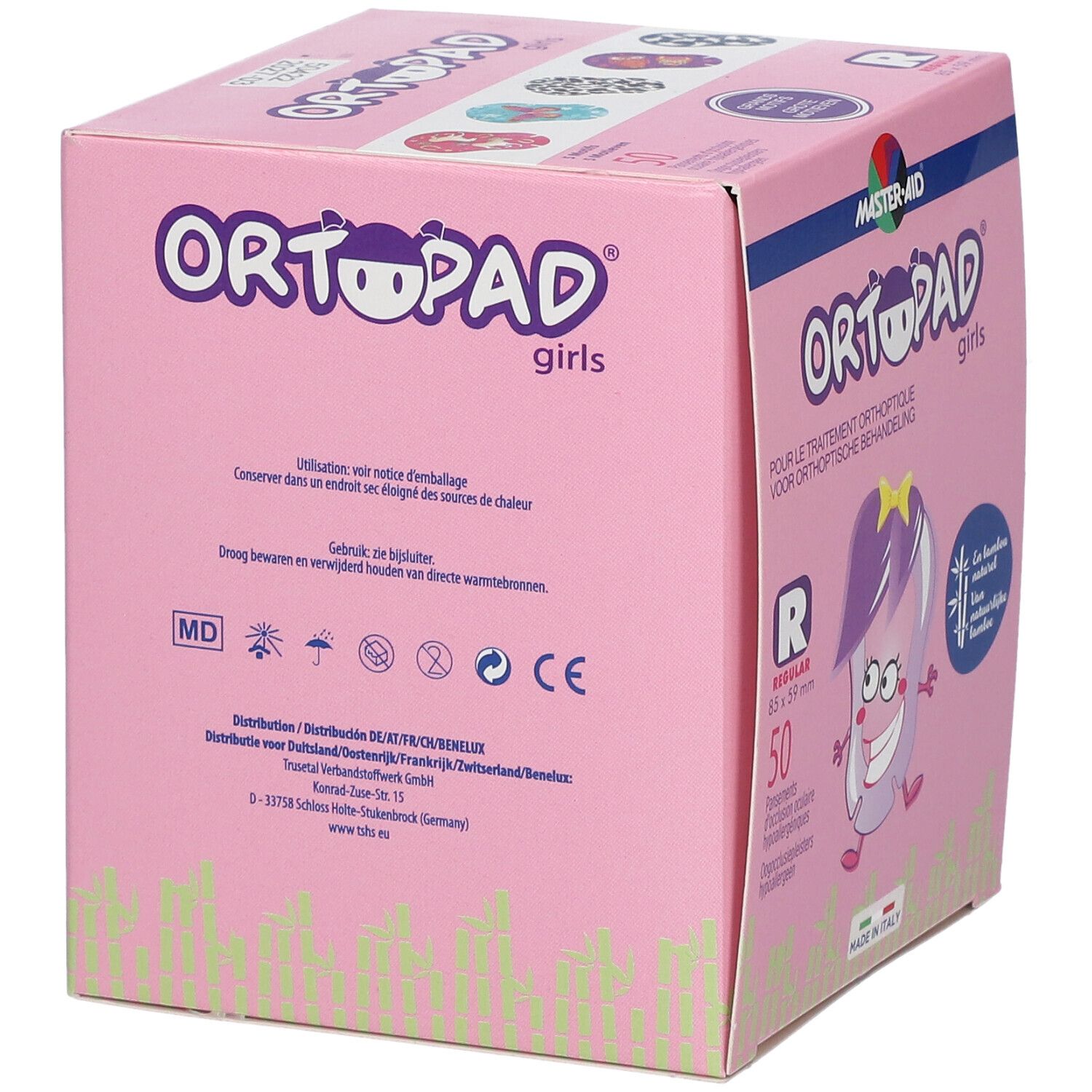 Boîte rose avec impressions. Impression : Ortopad Girls. Contient des informations et des symboles.