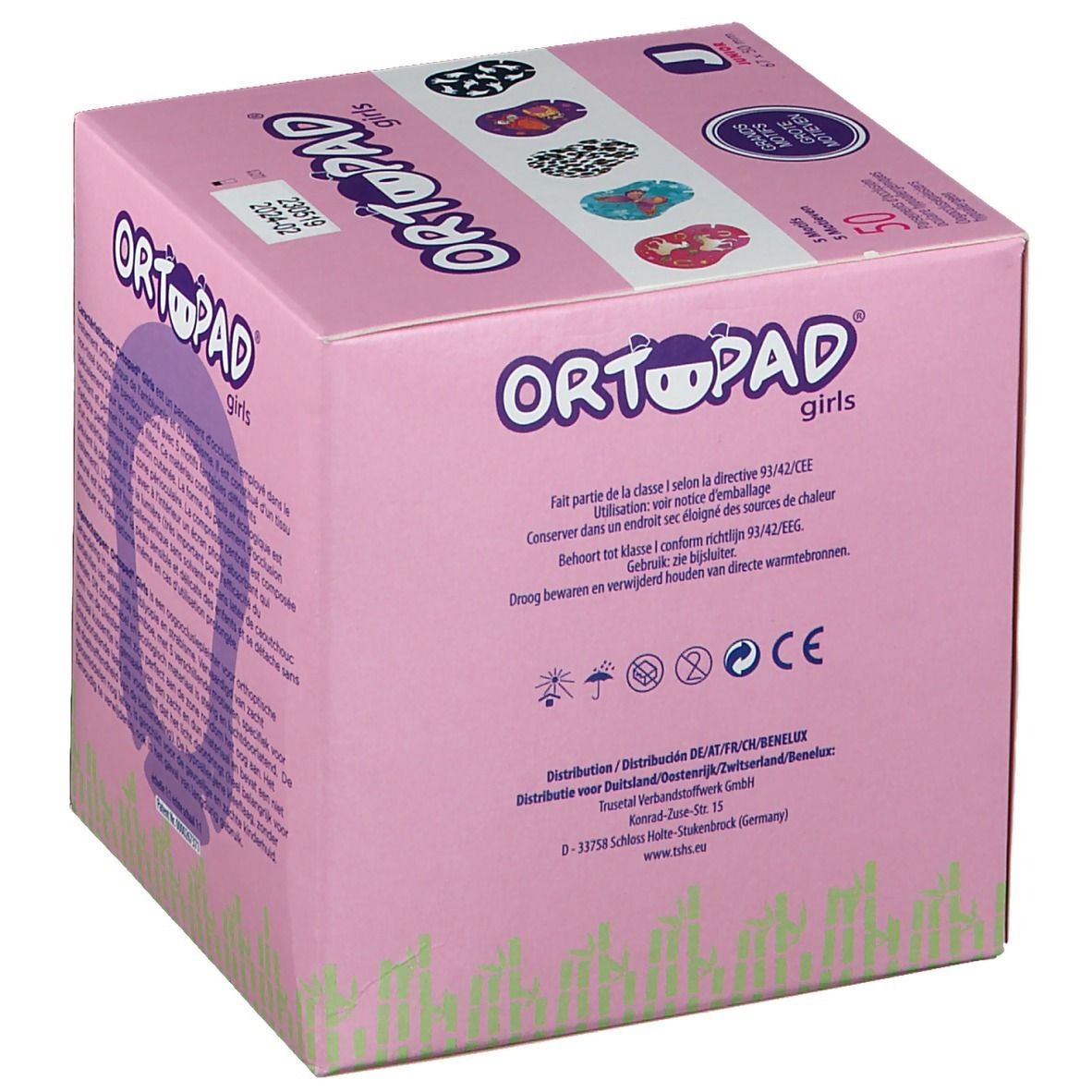 Boîte rose avec texte. Texte: ORTOPAD girls, Junior, 50 pièces. Arrière: avertissements et logos. Illustration.