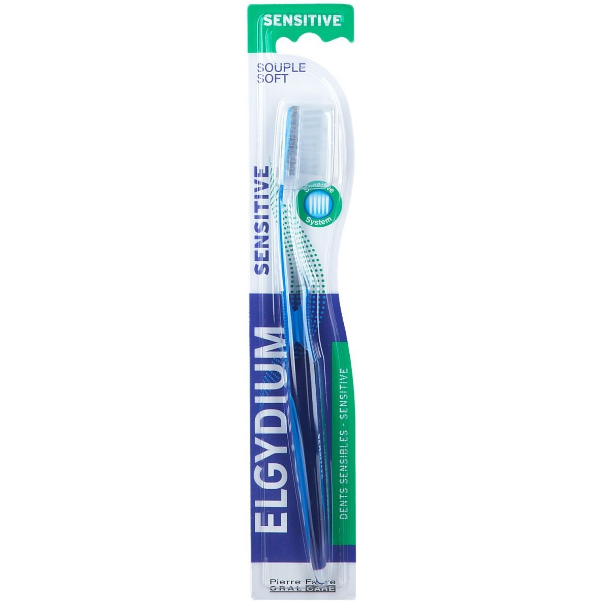 Brosse à dents bleue et blanche dans son emballage. Inscription : ELGYDIUM SENSITIVE. Pierre Fabre ORAL CARE.