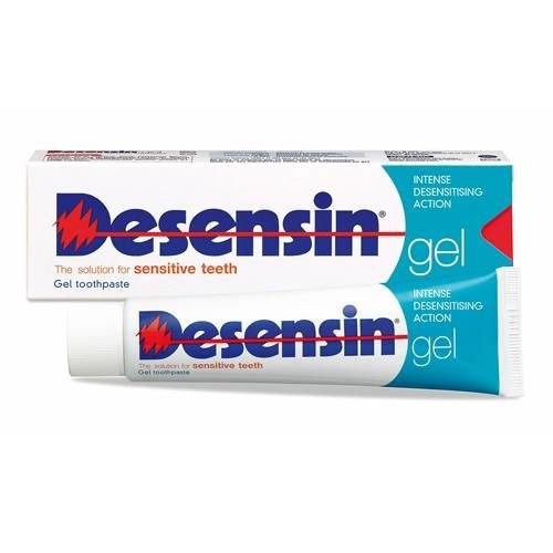 Tube et boîte de dentifrice avec nom du produit et logo éclair rouge. Emballage bleu et blanc.