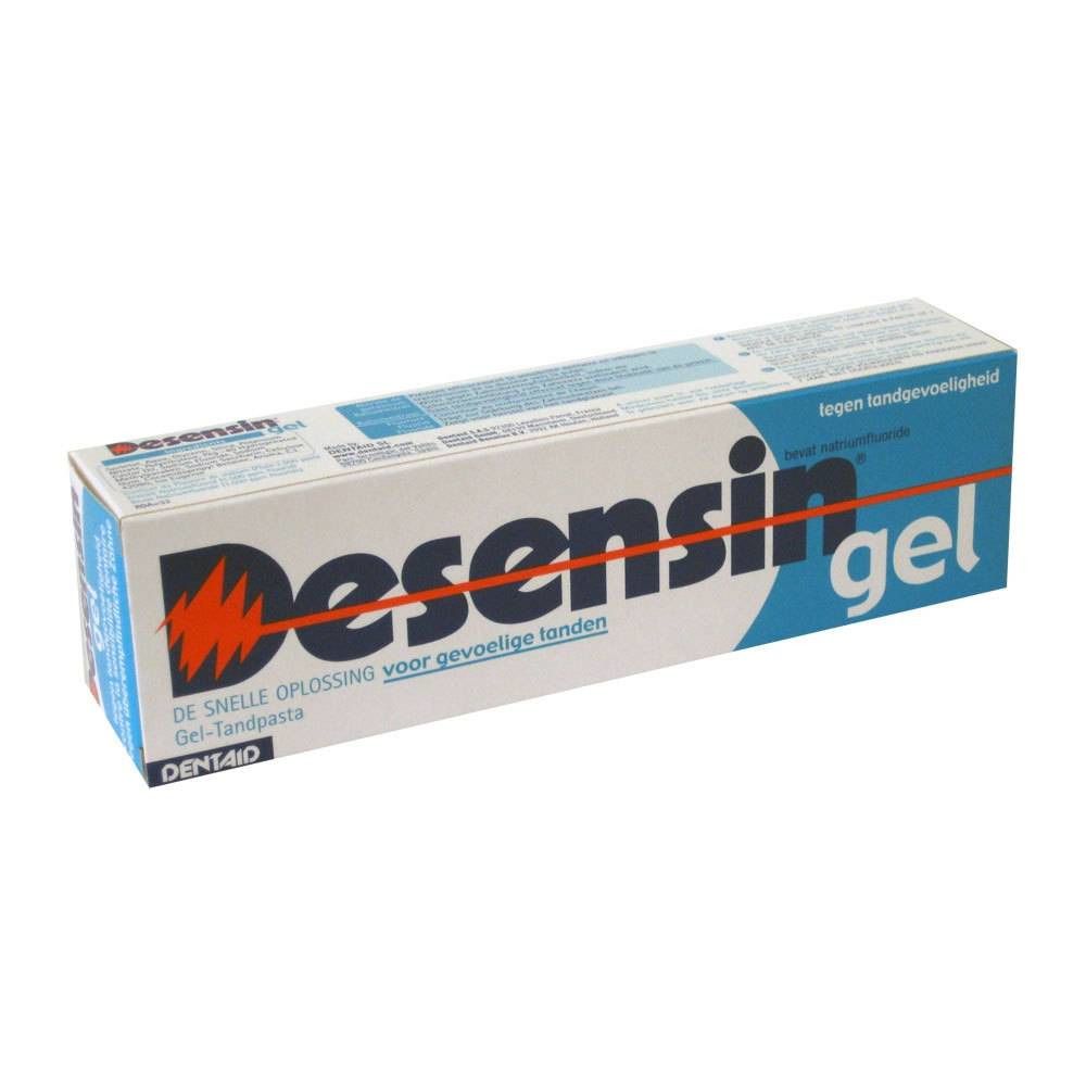 Boîte de dentifrice avec nom du produit et logo éclair rouge. Emballage bleu et blanc.