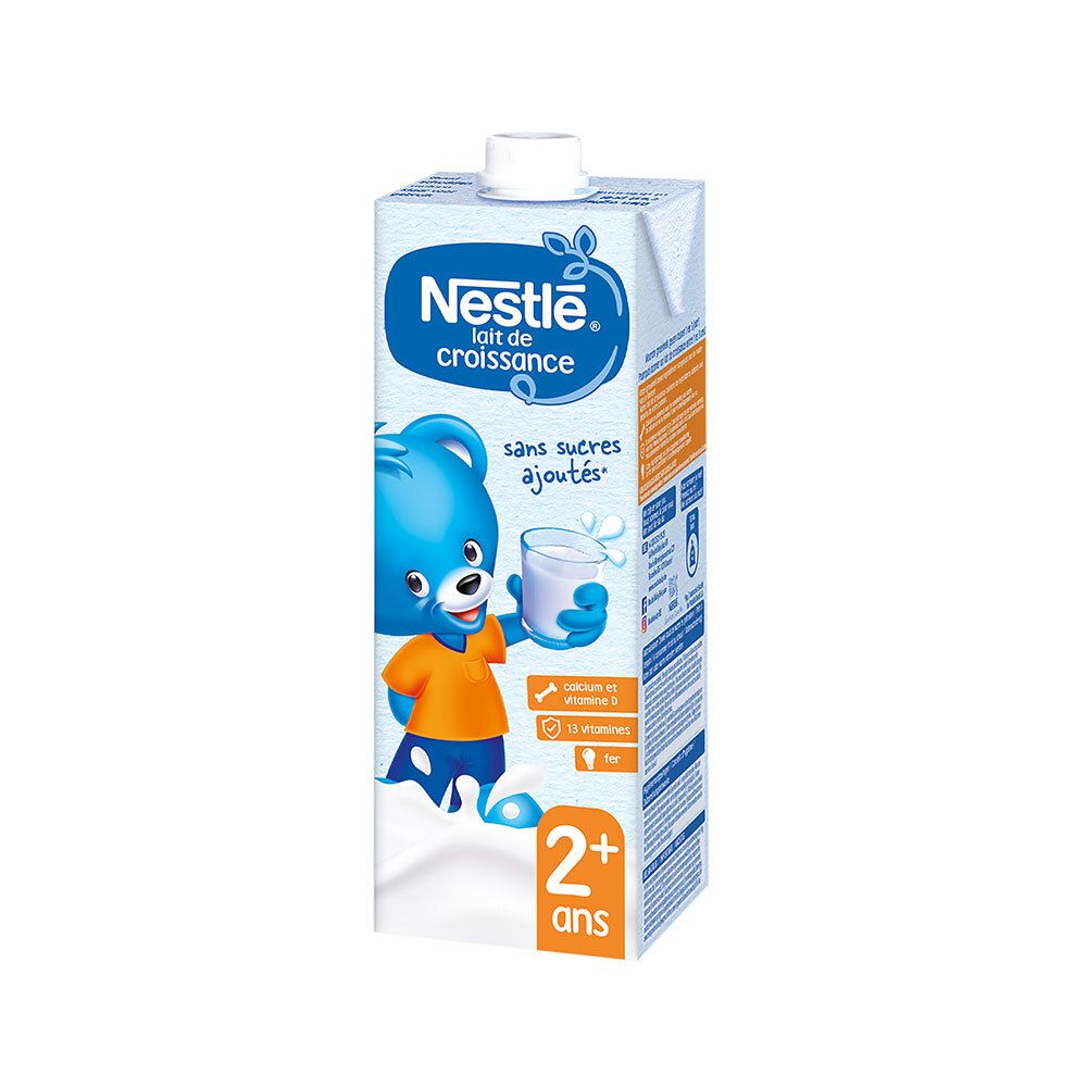 Brique de Nestlé Lait de croissance dès 2 ans. Contient du fer, sans sucres ajoutés, 13 vitamines. Illustration d'un ours bleu.