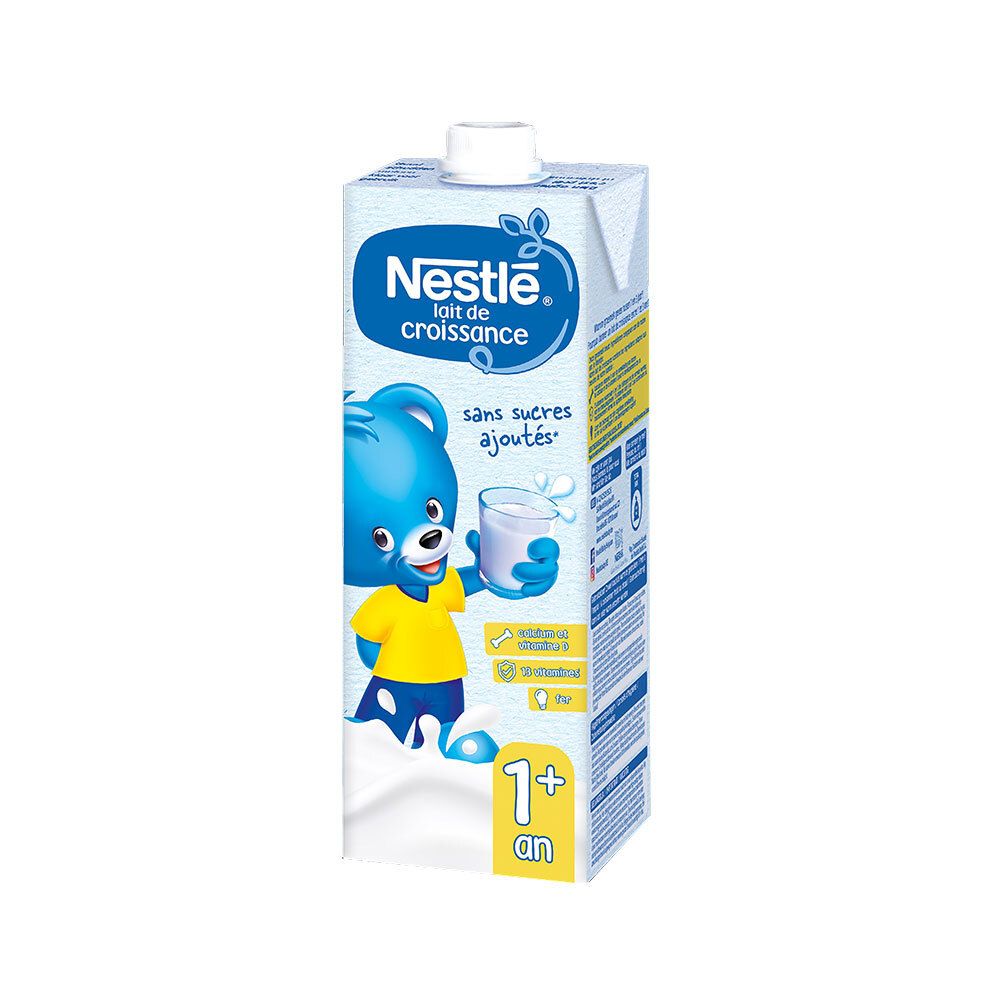 Brique Tetrapack Nestlé Lait de croissance. Texte: sans sucres ajoutés, 1+ an. Illustration: ours bleu avec verre de lait.