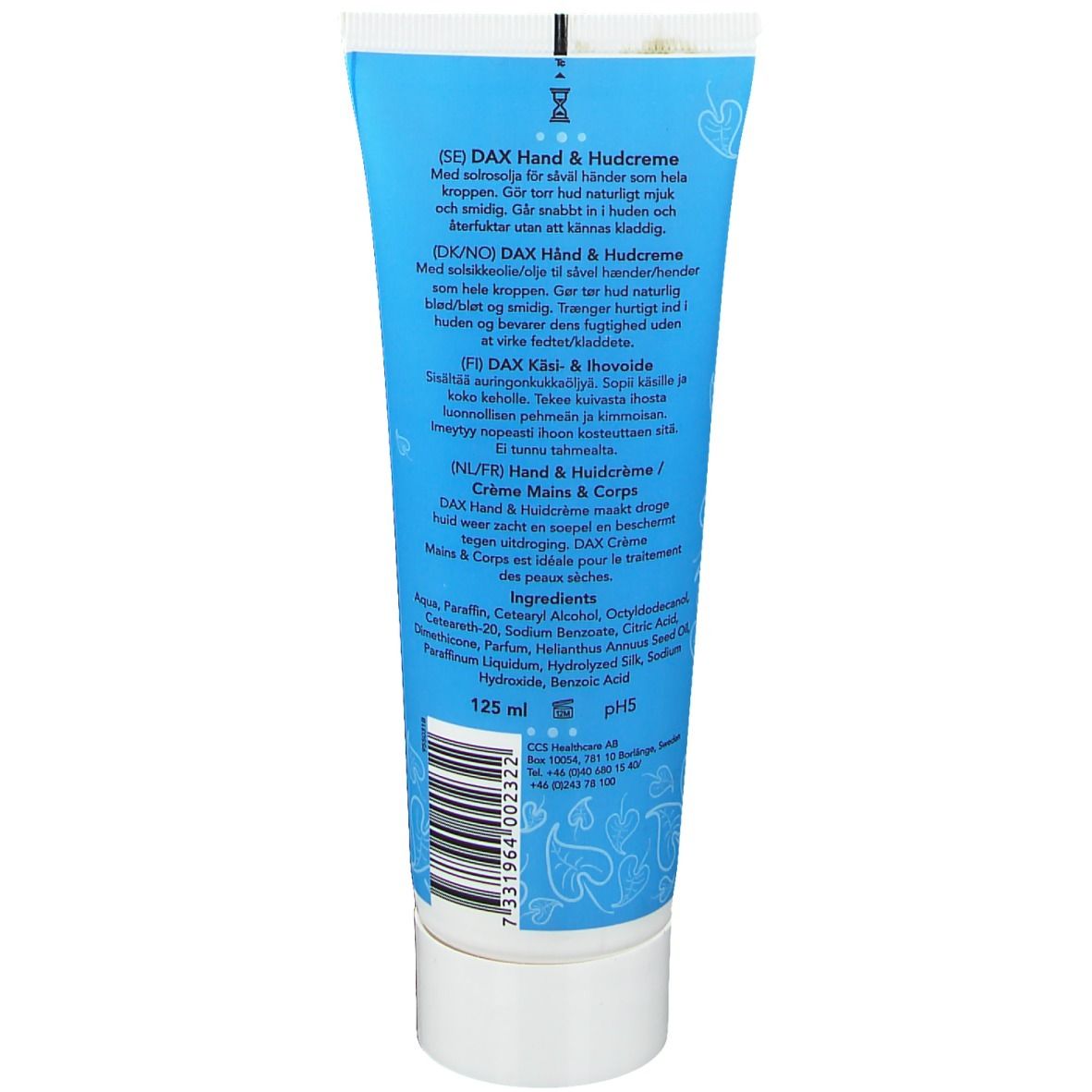 Dos du tube. Texte multilingue, ingrédients et code-barres. Bouchon blanc, fond turquoise.