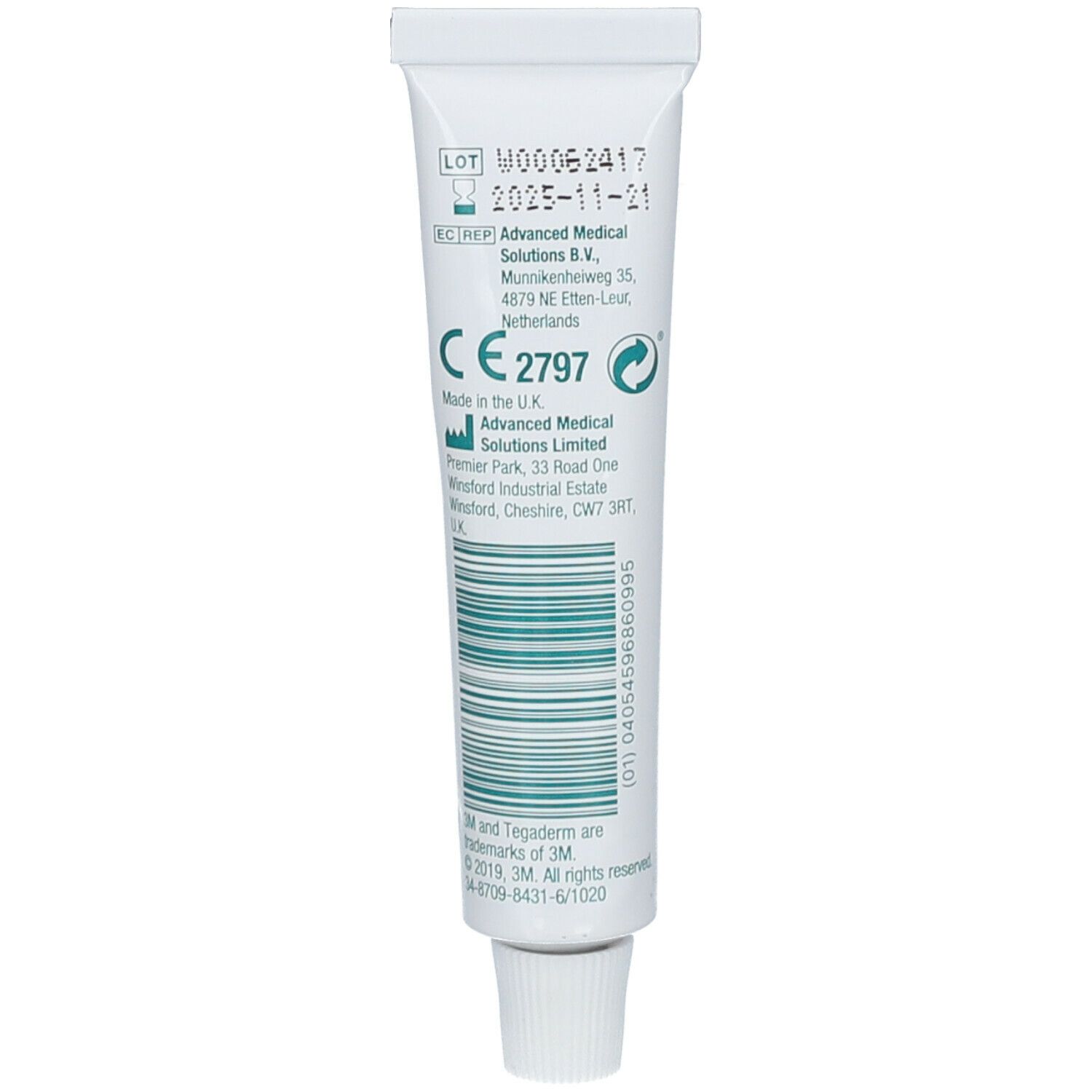 Tube blanc avec bouchon. Inscriptions : numéro de lot, date d'expiration, marquage CE, adresse du fabricant et code-barres.