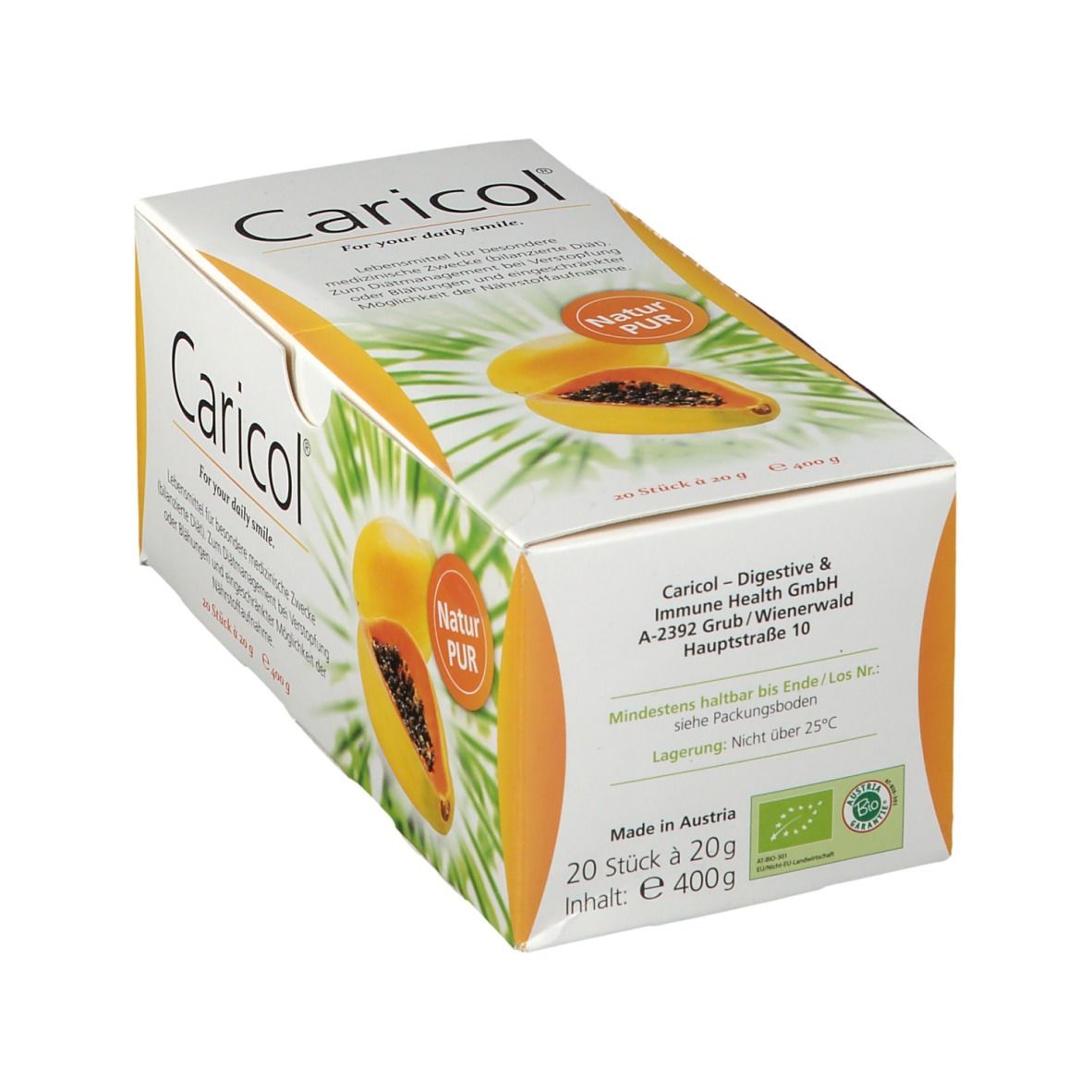 Weißer Karton mit Caricol-Logo und Papaya-Abbildung. Text: "Für Ihr tägliches Lächeln". Enthält 20 Sticks à 20 g. Mit Bio-Siegel.