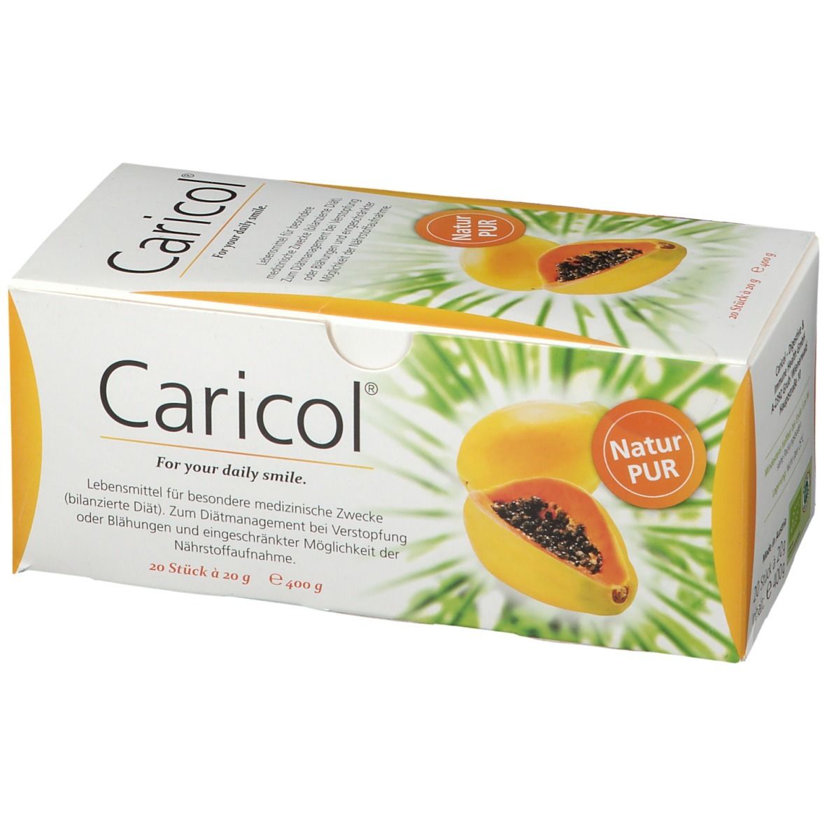 Weißer Karton mit Caricol-Logo und Papaya-Abbildung. Text: "Für Ihr tägliches Lächeln". Enthält 20 Sticks à 20 g.