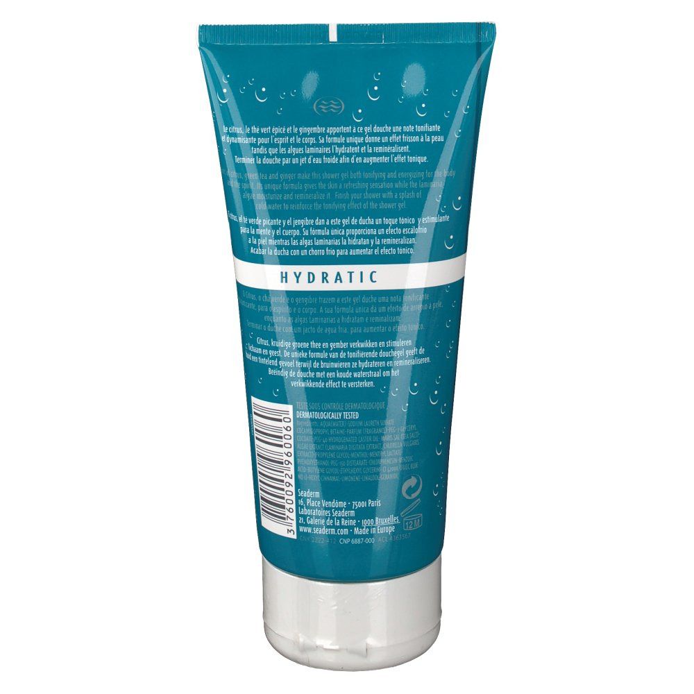 Achterkant van de tube. Turquoise met tekst en druppeldesign. Witte dop. Barcode en fabrikantinfo.