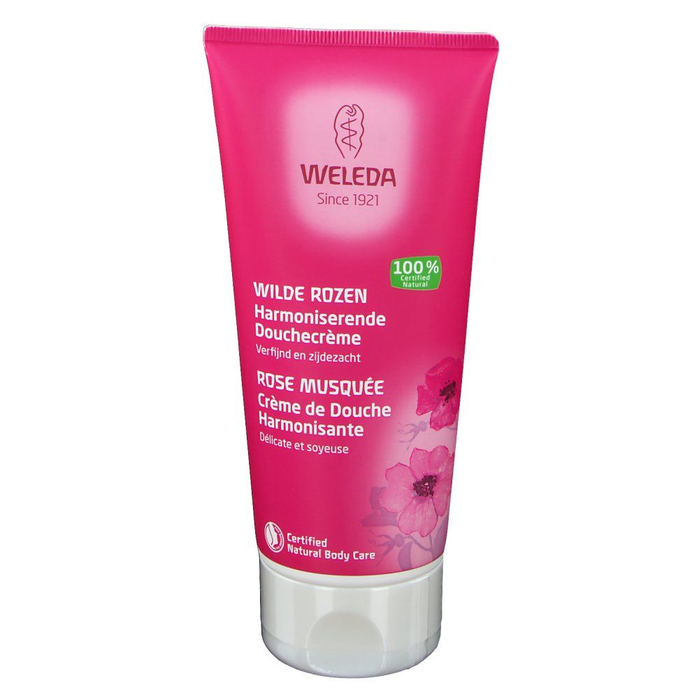 Tube rose avec nom du produit et logo. Logo "Weleda" et texte. "Wilde Rosen" et "Rose Musquée" imprimés. Produit naturel certifié.